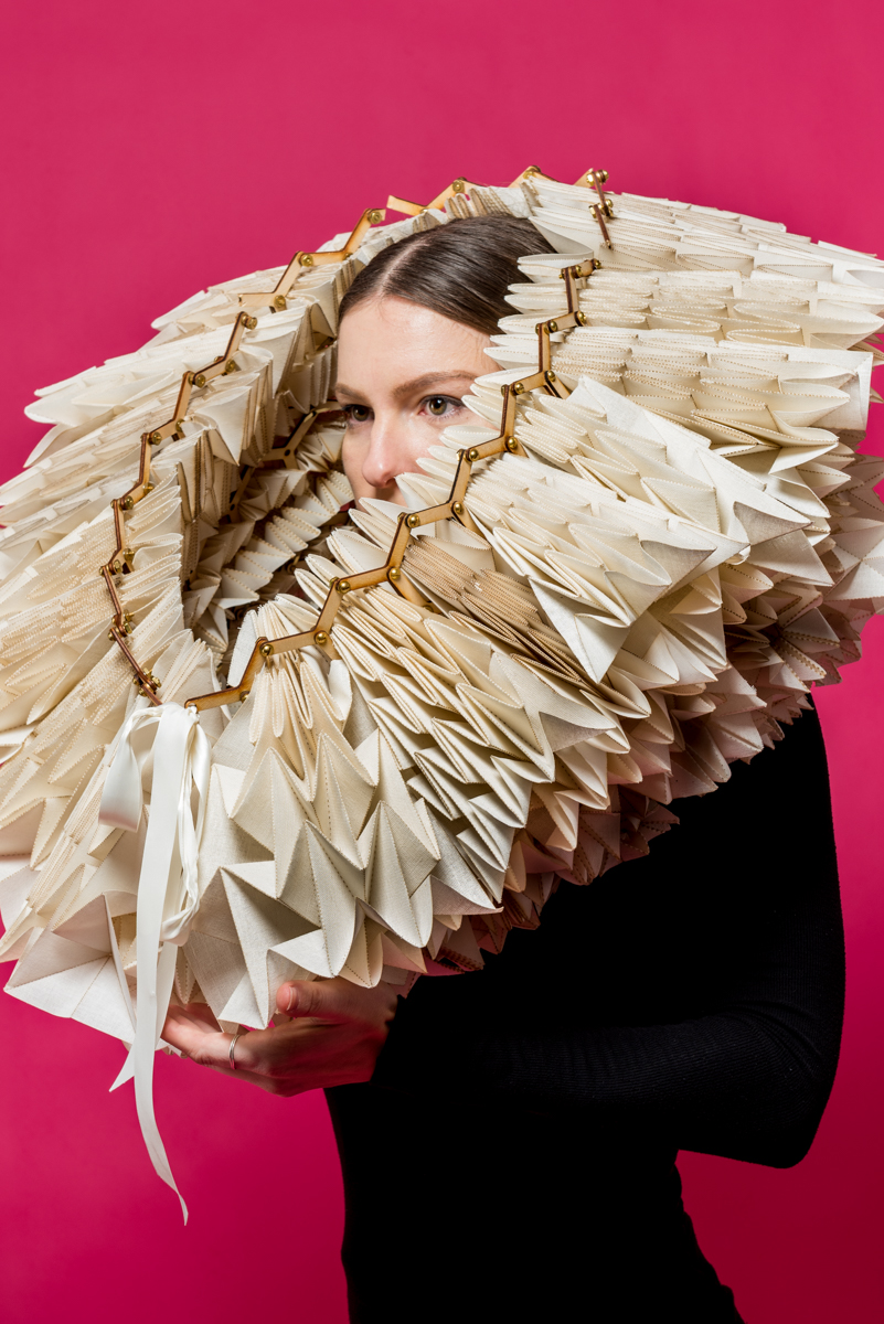 photo of woman wearing paper object