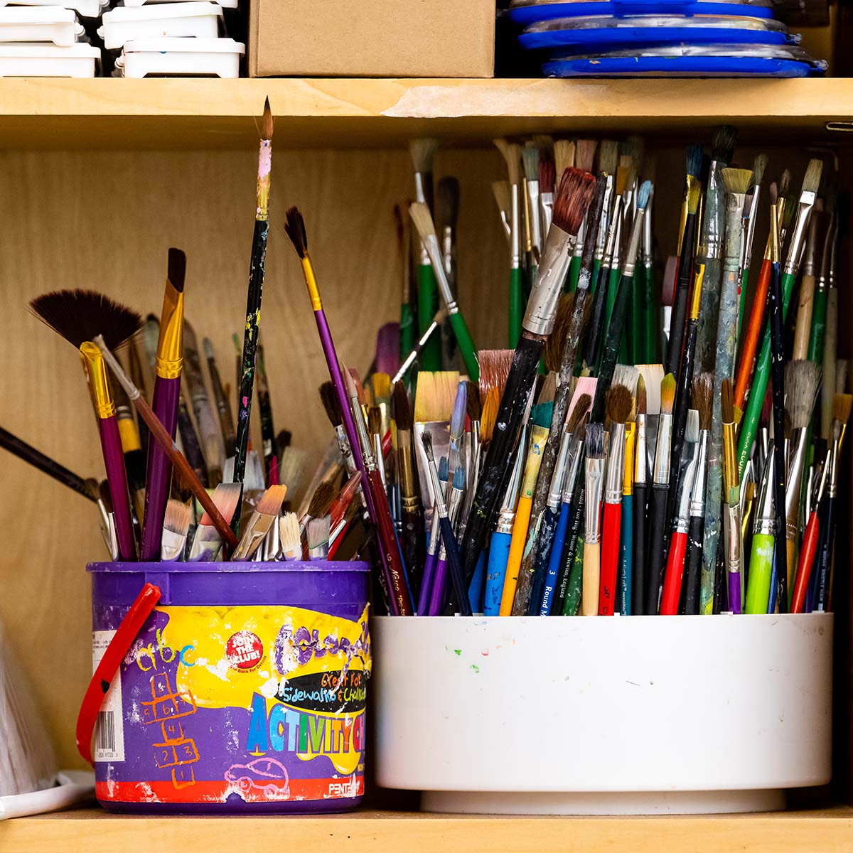 art supplies on a shelf