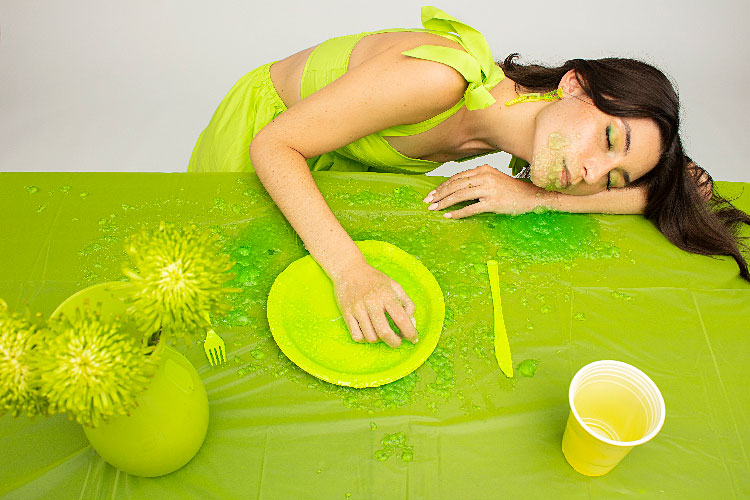 image in lime green of woman resting on a table