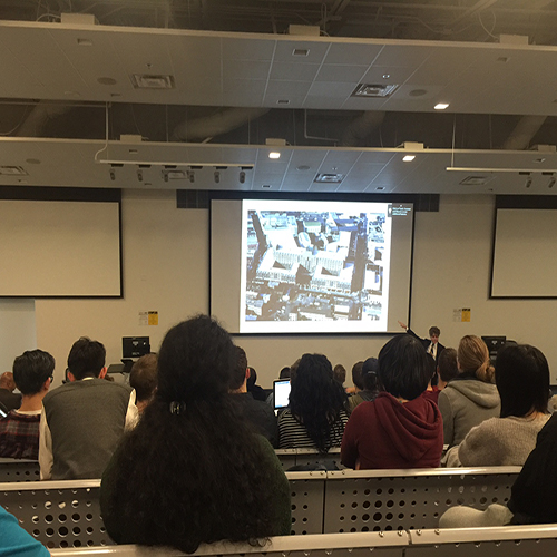 Tim Keane giving a lecture presentation to students. 