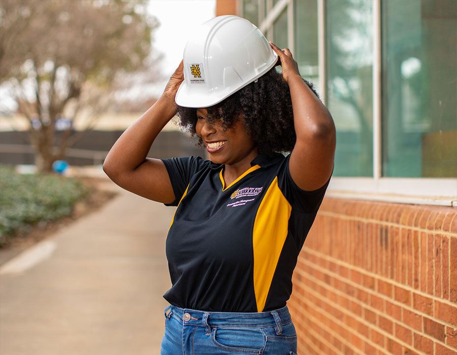 ksu construction management student puting on a hard hat