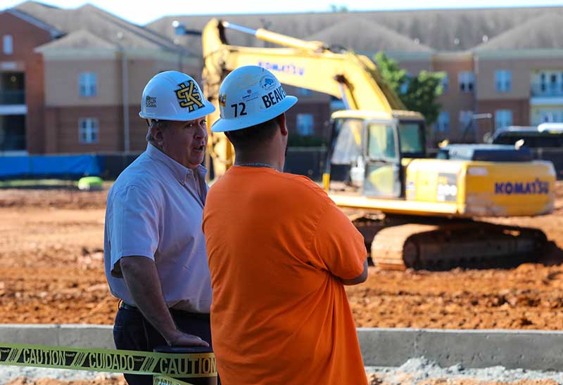 ksu faculty and student on construction site