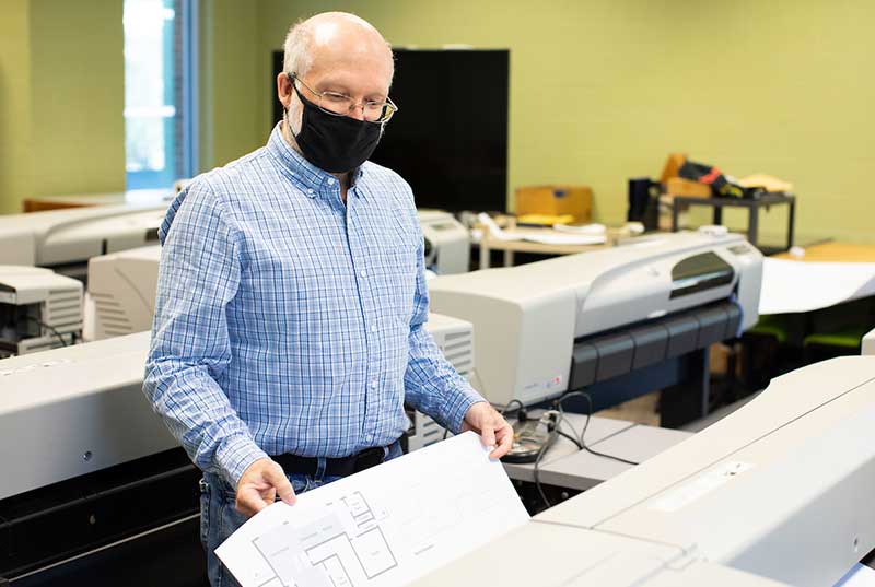 faculty memeber working in materials lab