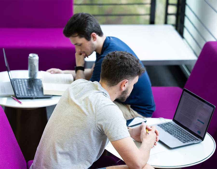 ksu students studying on their laptops.