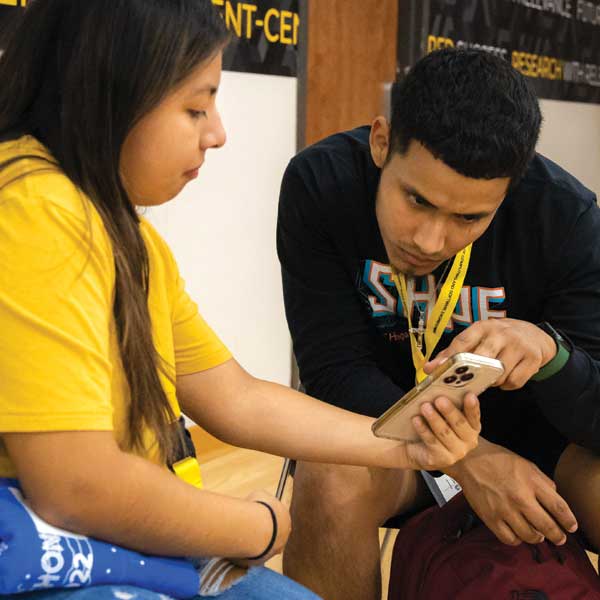 two ccse student networking at event