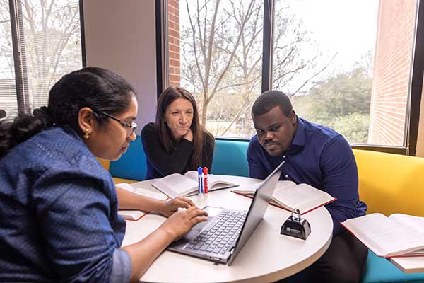 ccse grad students meeting together with laptop