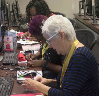 photo of teacher working with raspberry pie during workshop