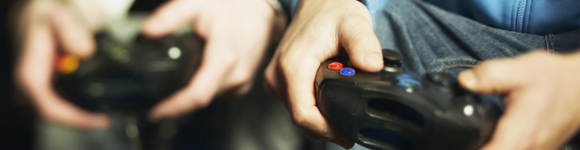 Students holding Xbox controllers 