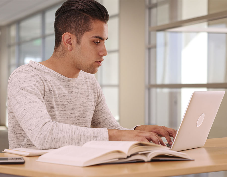 ksu student working on laptop