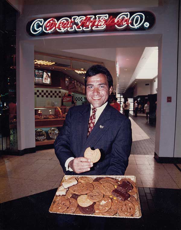 young Micheal Coles selling a plate of cookies