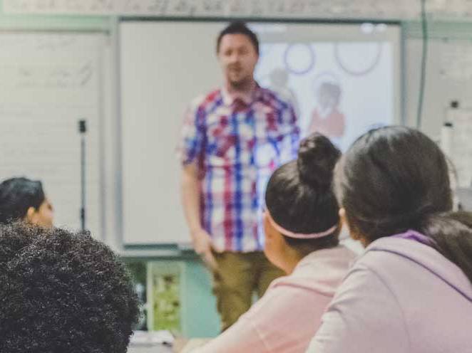 Teacher teaching a group of students