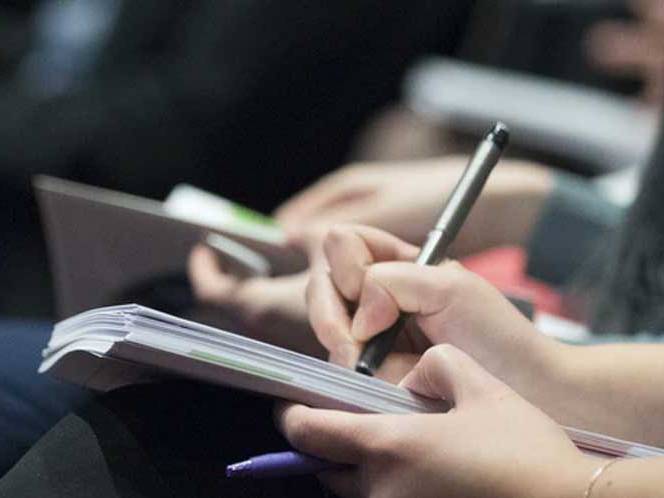 Student taking notes in their journal