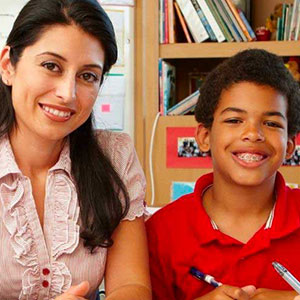 Teacher and student smiling for picture