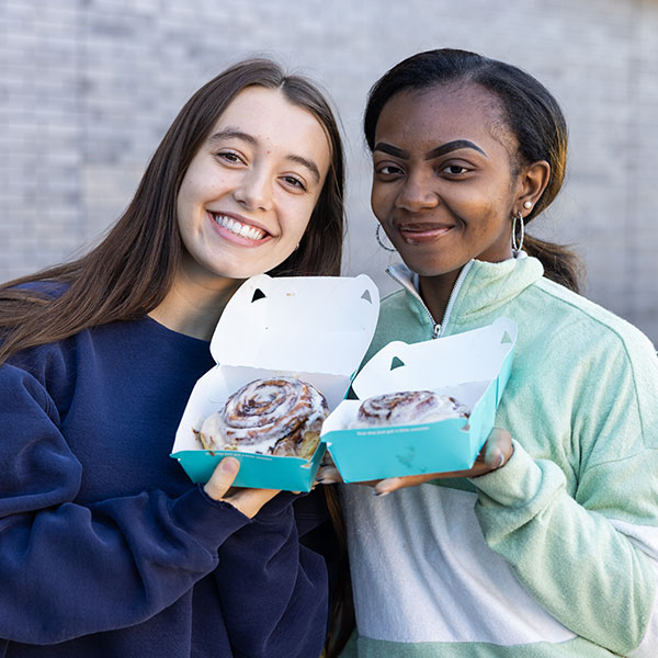 Students enjoying a sweet treat from Cinnabon