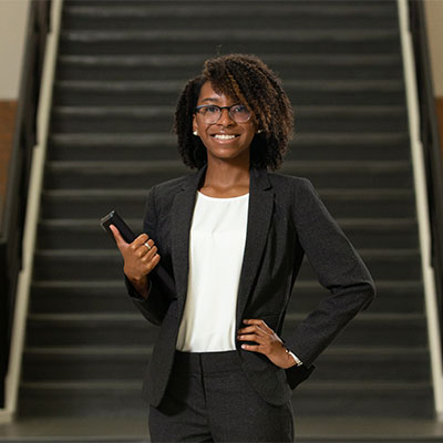 Student infront of a staircase