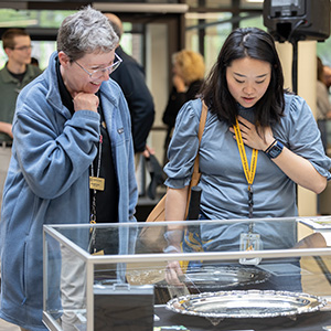 Visitors enjoying artifact on display at the library