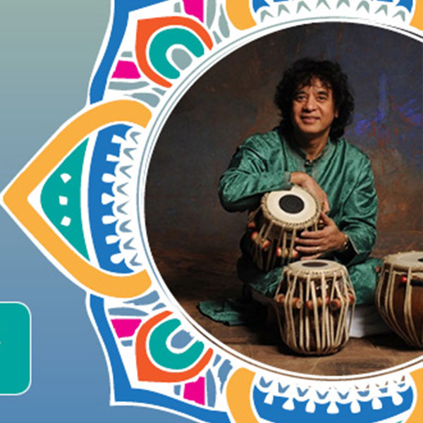 Tabla Master Zakir Hussain playing the drums.