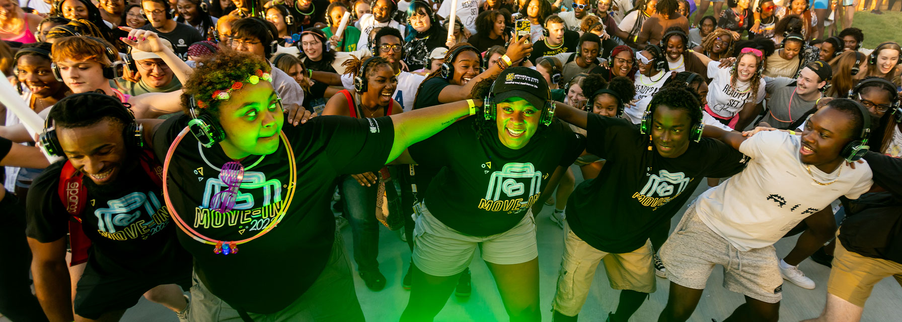 Residential students dancing together at Move-In event