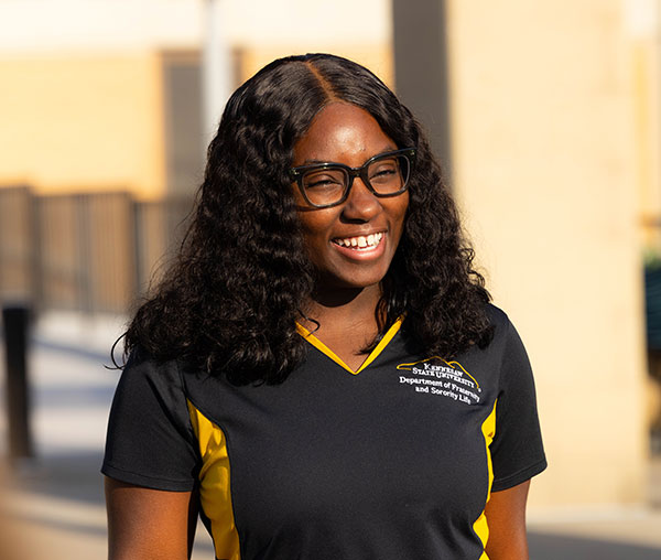 ksu employee standing outside smiling