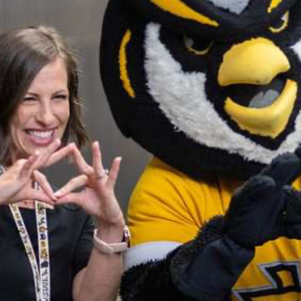 woman with scrappy making owl eyes