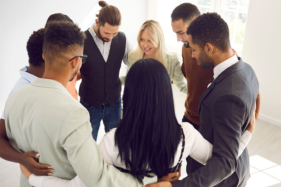 large group of business people in a connected circle.