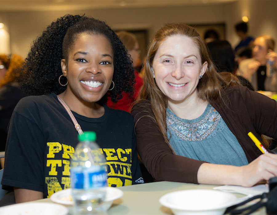 Two ksu employees smiling.