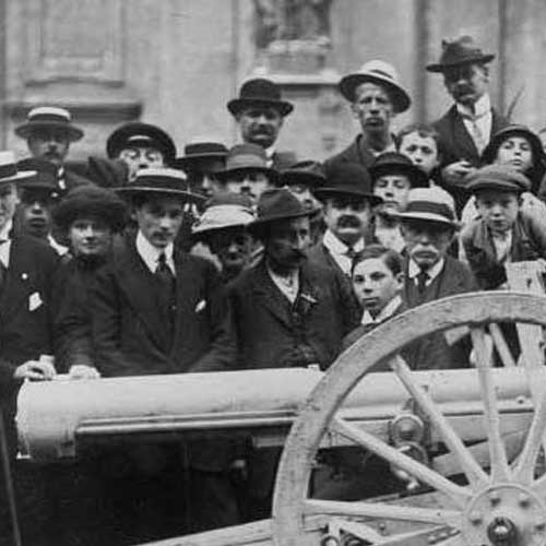 People gathering around a cannon