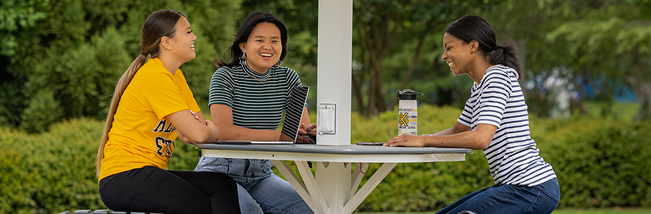 students talking on campus