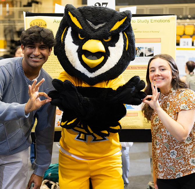 man and woman showing owl eyes with scrappy