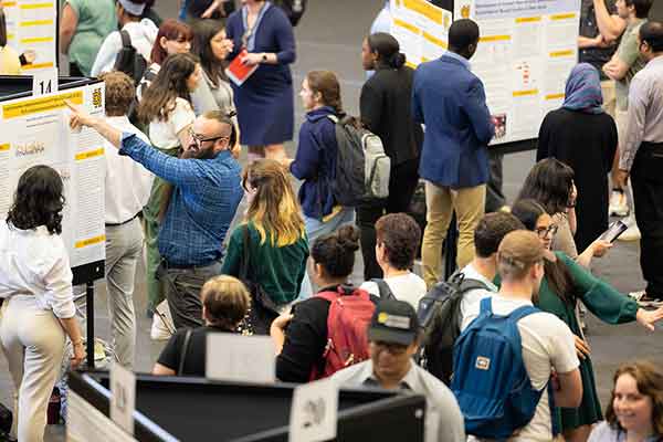 Photo of spring 2023 Symposium overhead shot of students showing research