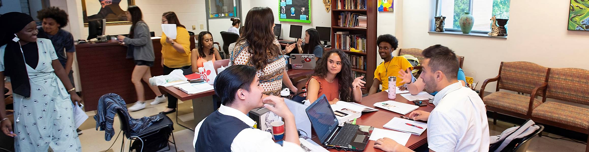 Group of KSU students at the global village center collaborating.