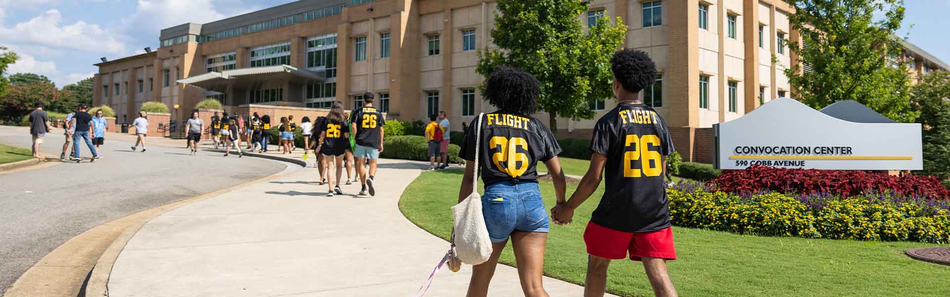 KSU flight 26 students walking to the convocation center.