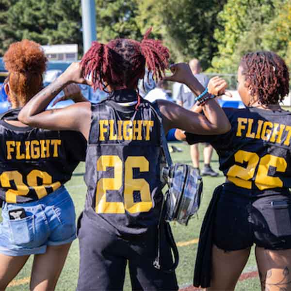 KSU students wearing a flight 26 jersey.