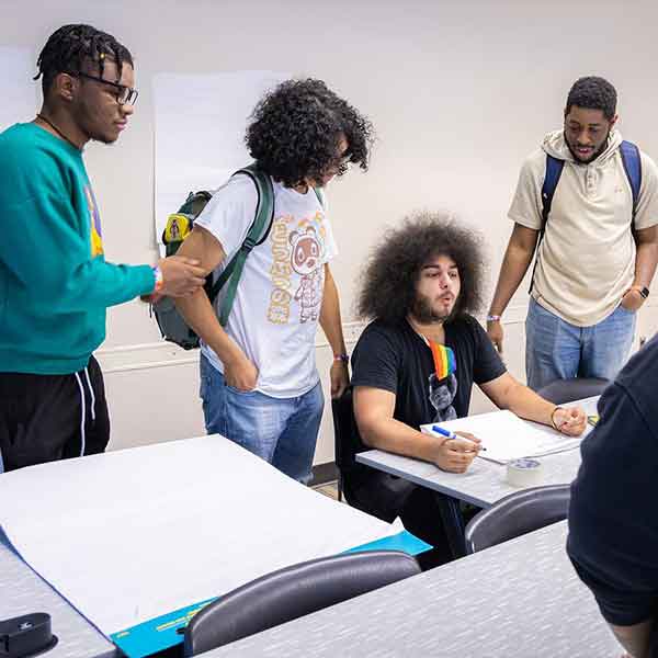 group of lgbtq students collaborating.