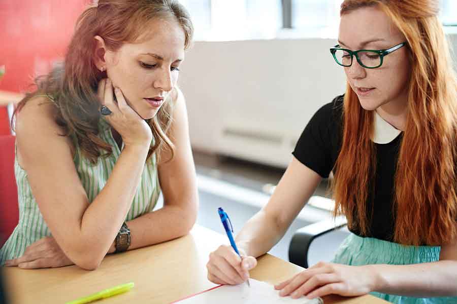 two women studying together