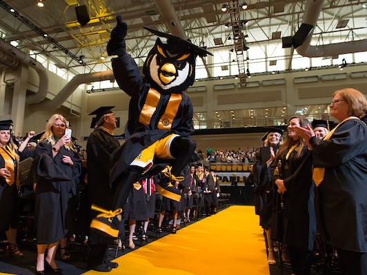 Scrappy celebrating at graduation.