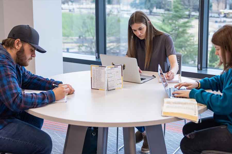 KSU Students sitting at a table together.