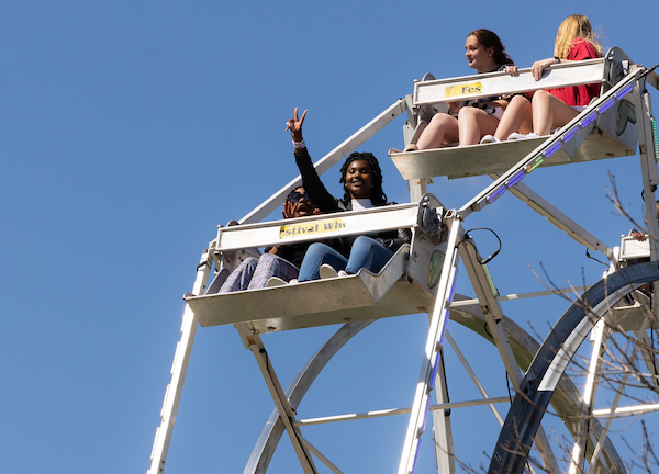 students on the ferris wheel at ksu day.