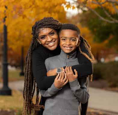 ksu student posing with child