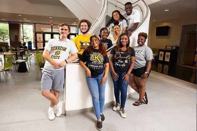 group of ksu student posing together on stairs