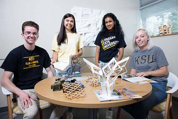 ksu team sports group posing with project