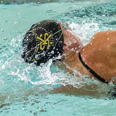 ksu swim team member in pool