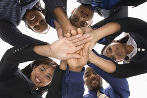 students with their hands together