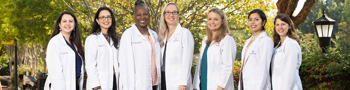 women in white coats