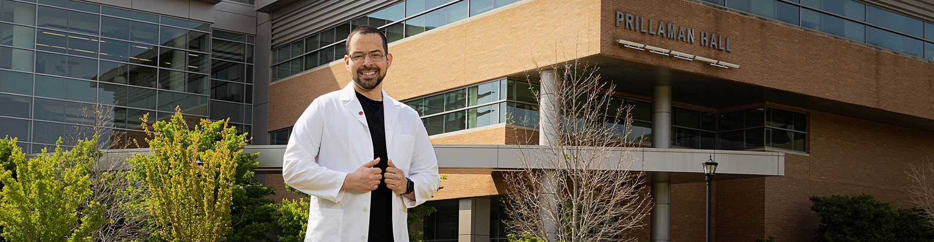 nursing grad student in front of prillaman hall